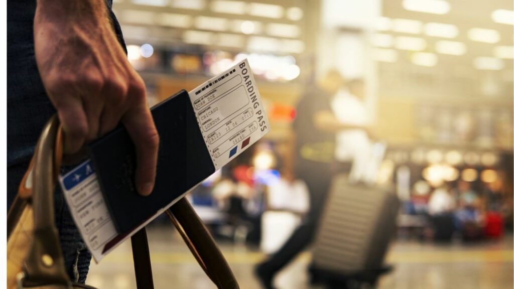 Man holding a boarding pass